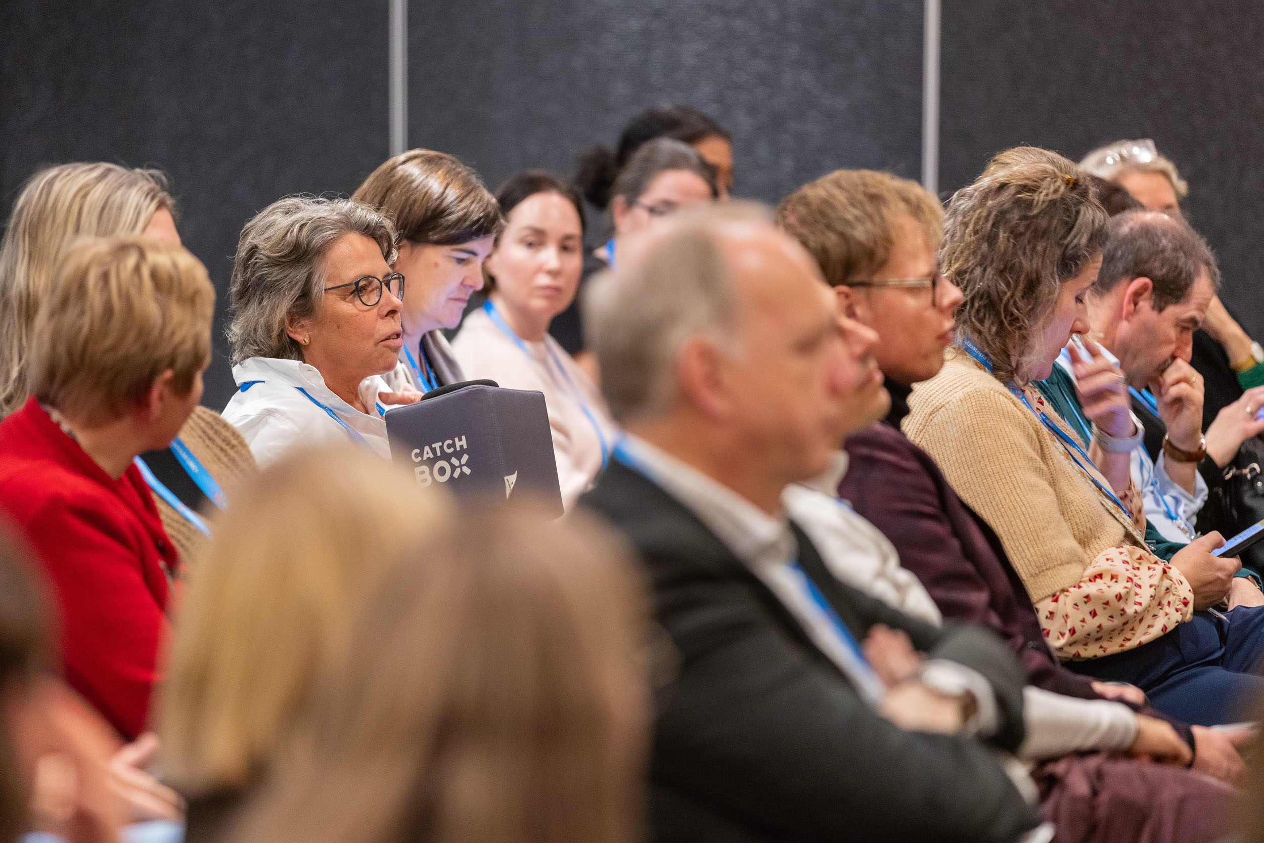 Deelnemer PGT-symposium met catchboxmicrofoon